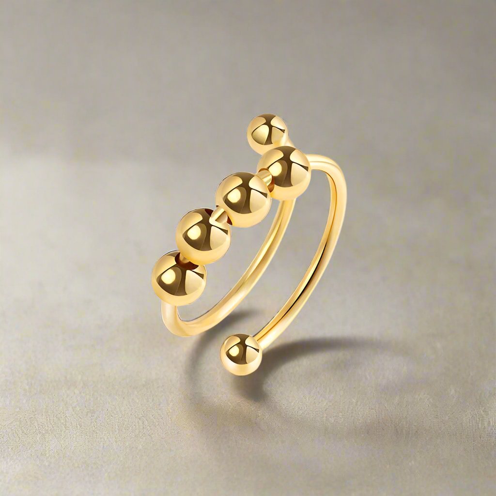 Beady fidget ring in gold
